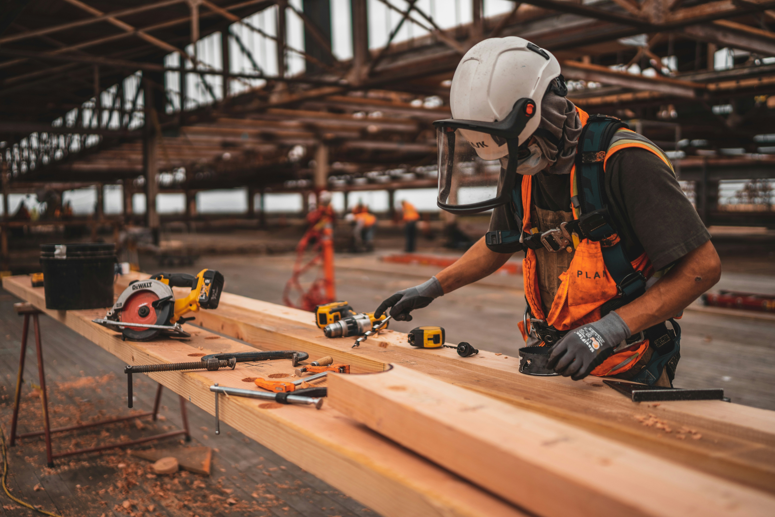 EHS Lone Worker Cutting Wood Empty Factory